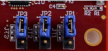 Three blue jumpers labeled JP3, JP2, and JP1 on a red circuit board.