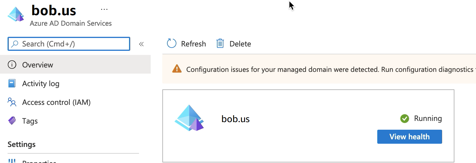 Layar layanan domain Azure AD yang menampilkan bob.us grup sumber daya yang berjalan.