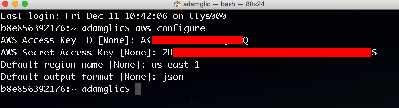 Terminal window showing the aws configure command.