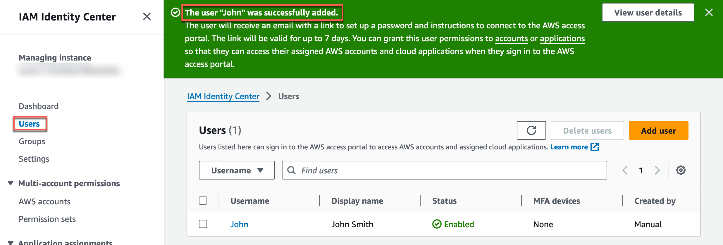 AWS IAM Identity Center interface showing a confirmation message that user "John" was successfully added, with user details listed below.