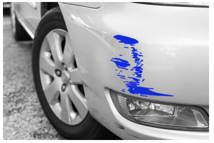 Close-up of a car's front section with a blue scratch mark highlighted on the side panel.