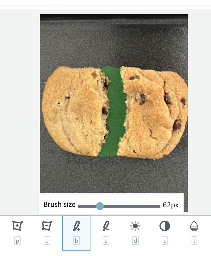 Chocolate chip cookie split in half with green filling visible between the two halves.