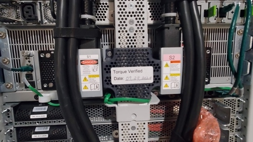 
          Photographs showing AWS Outposts AC-to-DC power supplies and bus bar power
            distribution
        