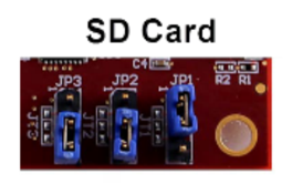 Circuit board with three blue jumpers set to specific positions for SD card boot mode.